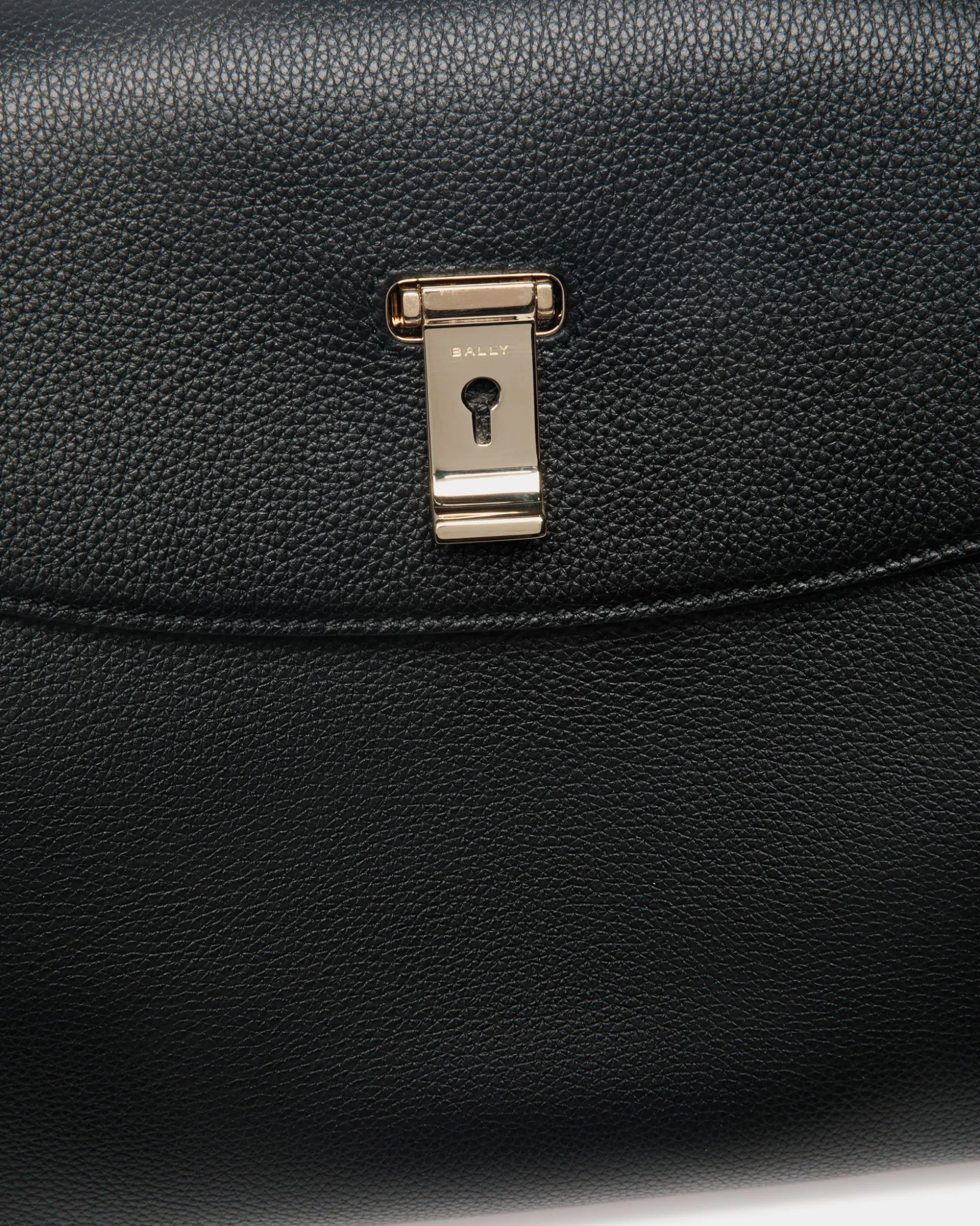 Lock Me Top Handle Bag In Black Grained Leather